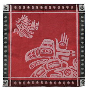 A red jacquard woven napkin with a black dotted border light-red Raven designs.
